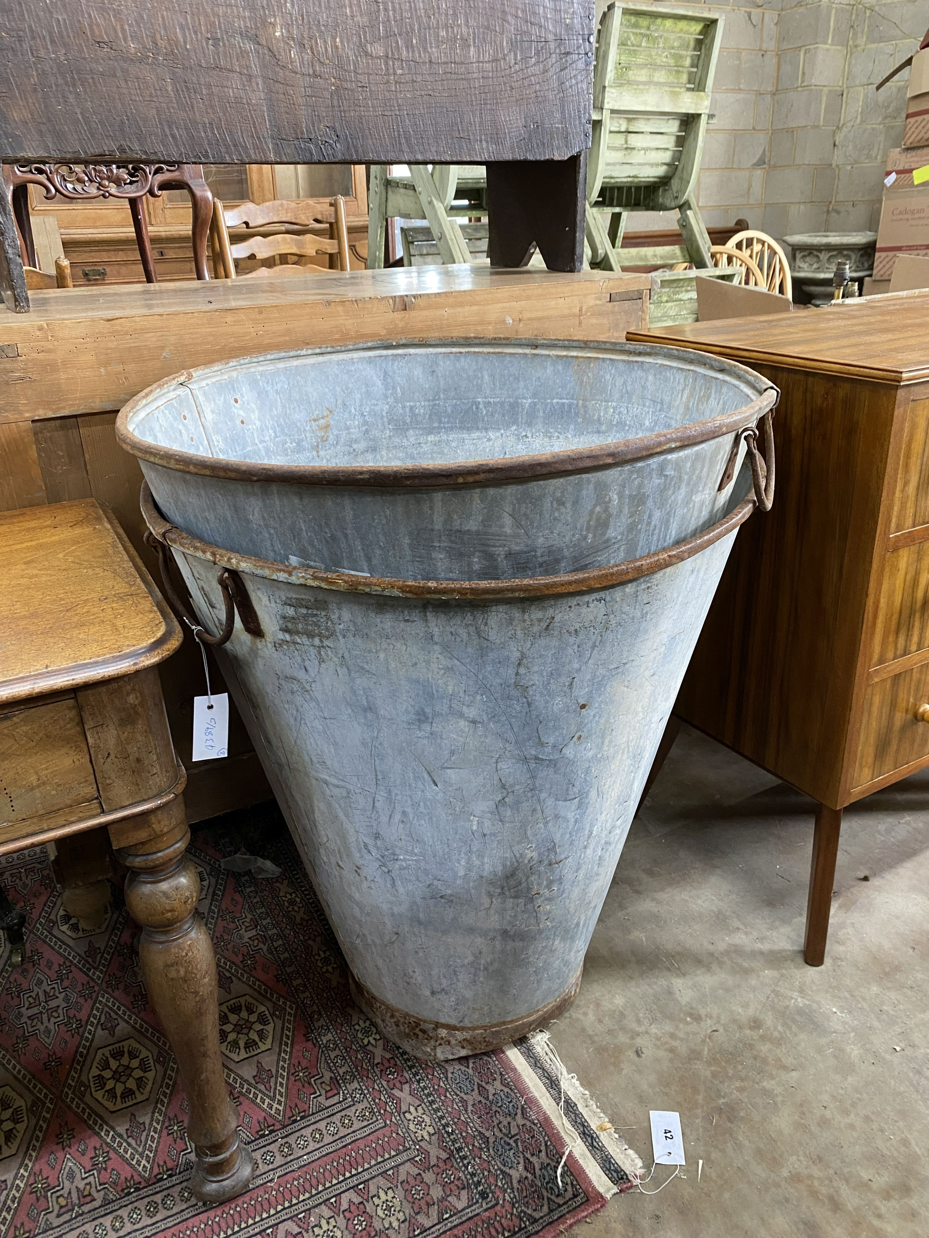 A pair of large vintage galvanised iron handled hoppers, diameter 69cm, height 75cm